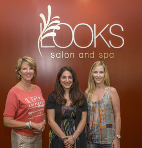 Looks Salon and Spa is planning its annual Looks for Life fundraiser for suicide prevention services at Grassroots.  Attending a recent planning meeting were (from l.) Looks owner Marilyn Petersen. Grassroots Director of Crisis Services Nicole DeChirico and Looks manager Briagh Stott.
